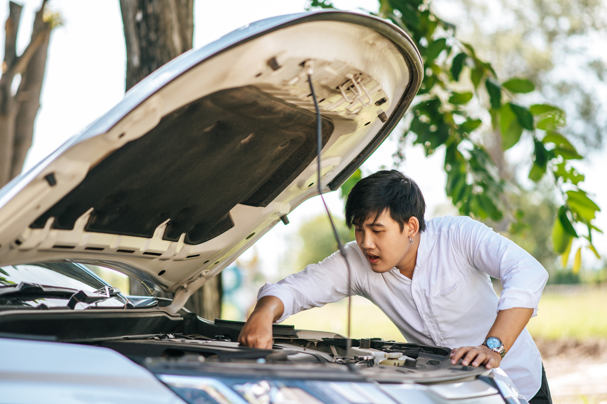 man-opens-hood-car-repair-car-due-breakdown (1)